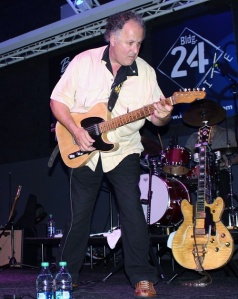 Arlen playing guitar at Building 24 in October 2014