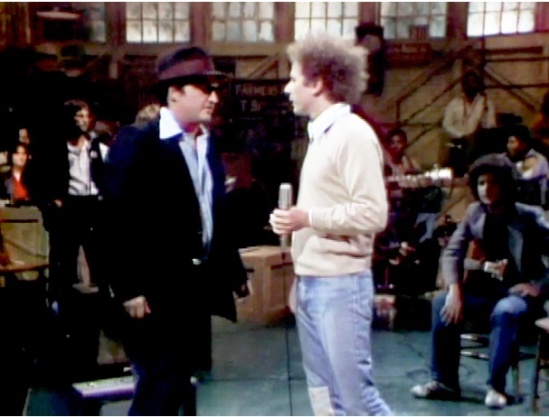 John Belush (Left), SNL Host (Middle), and Arlen Roth (right) on the set of SNL, 1978